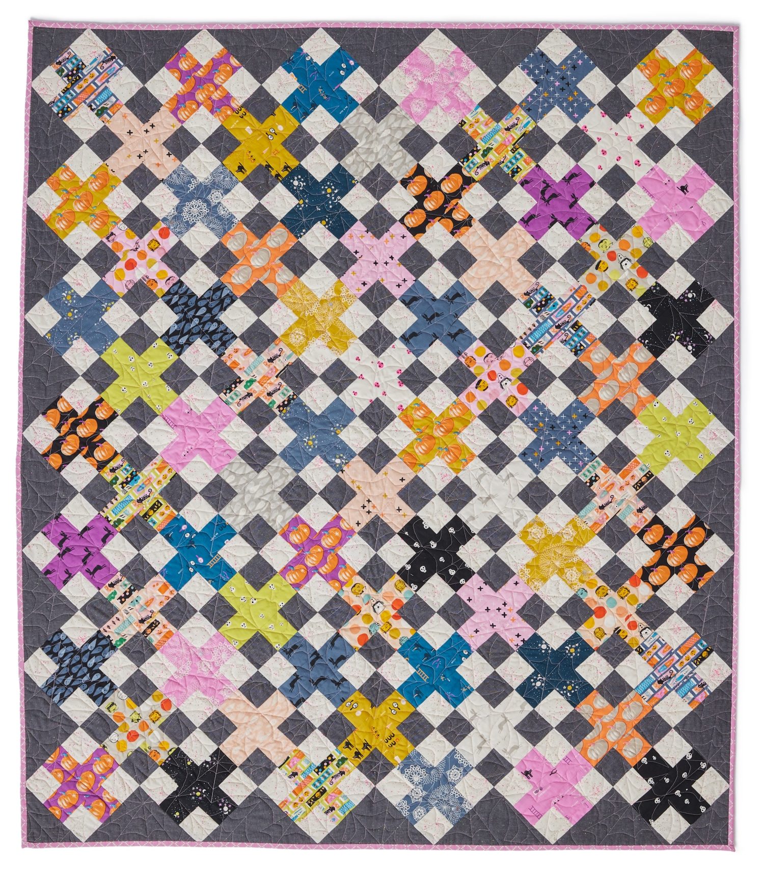 Cross the Line quilt sewn by McKenzie in Spooky Darlings fabrics with pumpkins, bats, and brights
