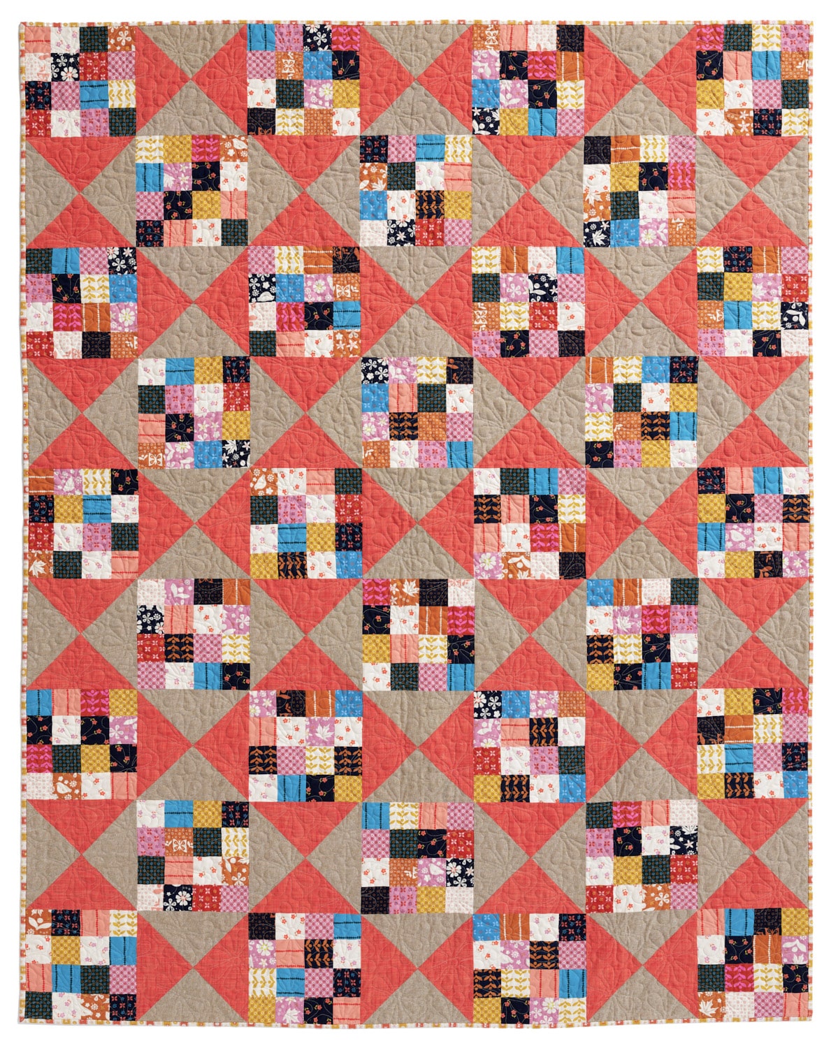 Pocket Change quilt made with small squares in warm autumn tones
